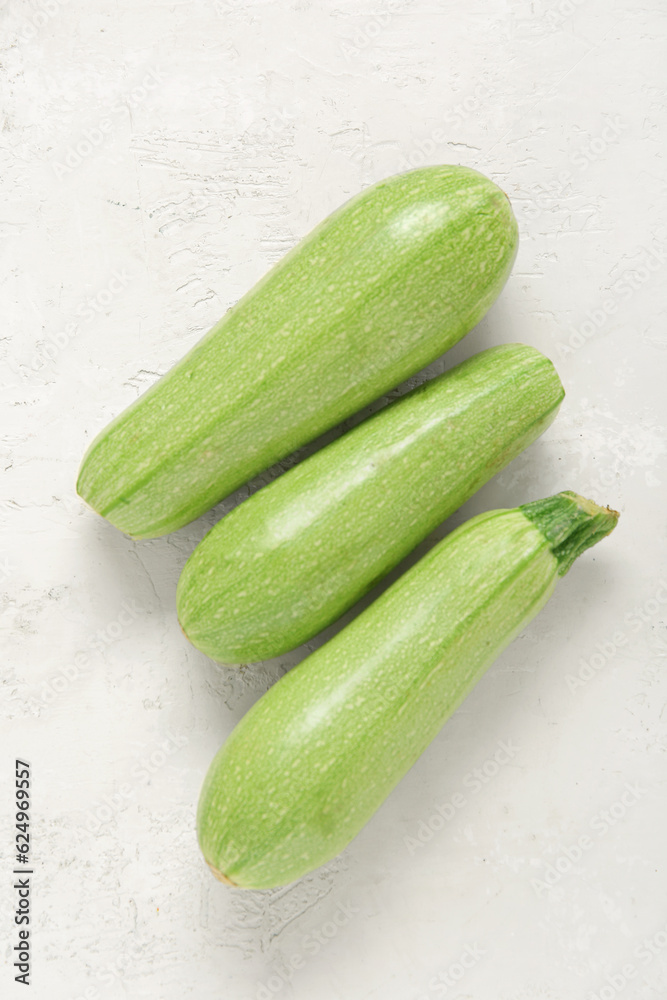 Fresh green zucchini on light background