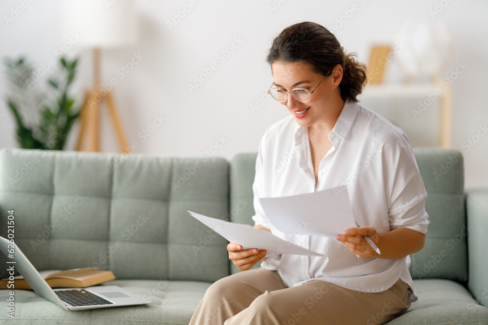 woman working on laptop at home