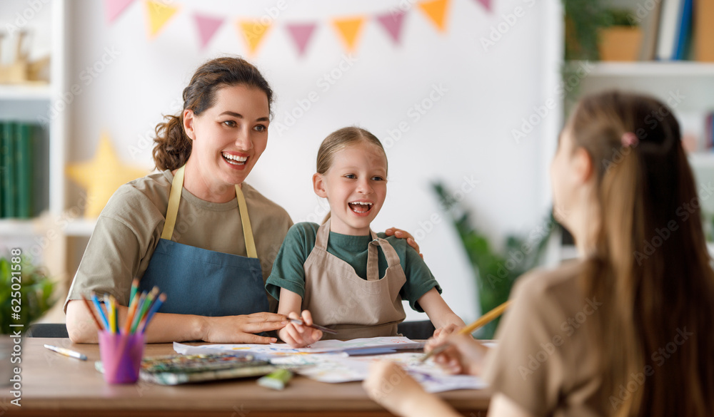 kids and teacher at the art class