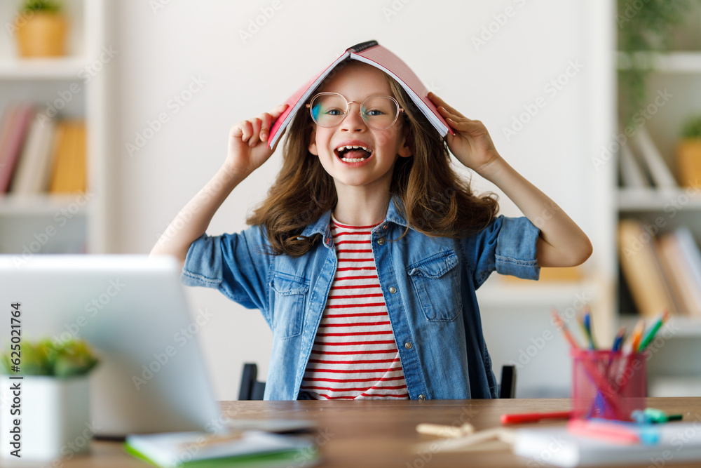 Girl doing homework or online education.