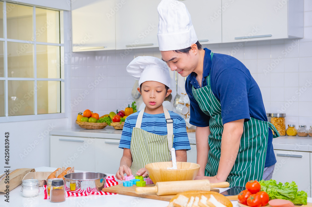 father and son cooking