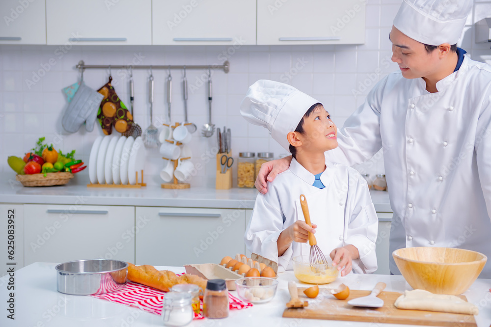 father and son cooking