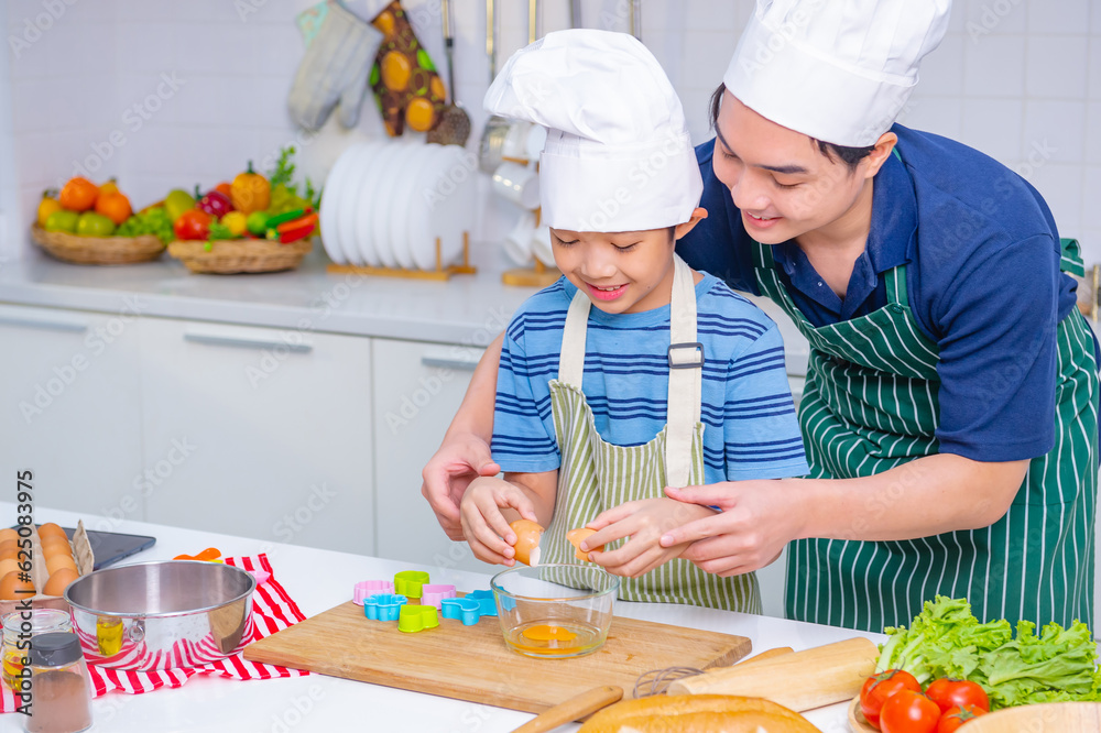 father and son cooking