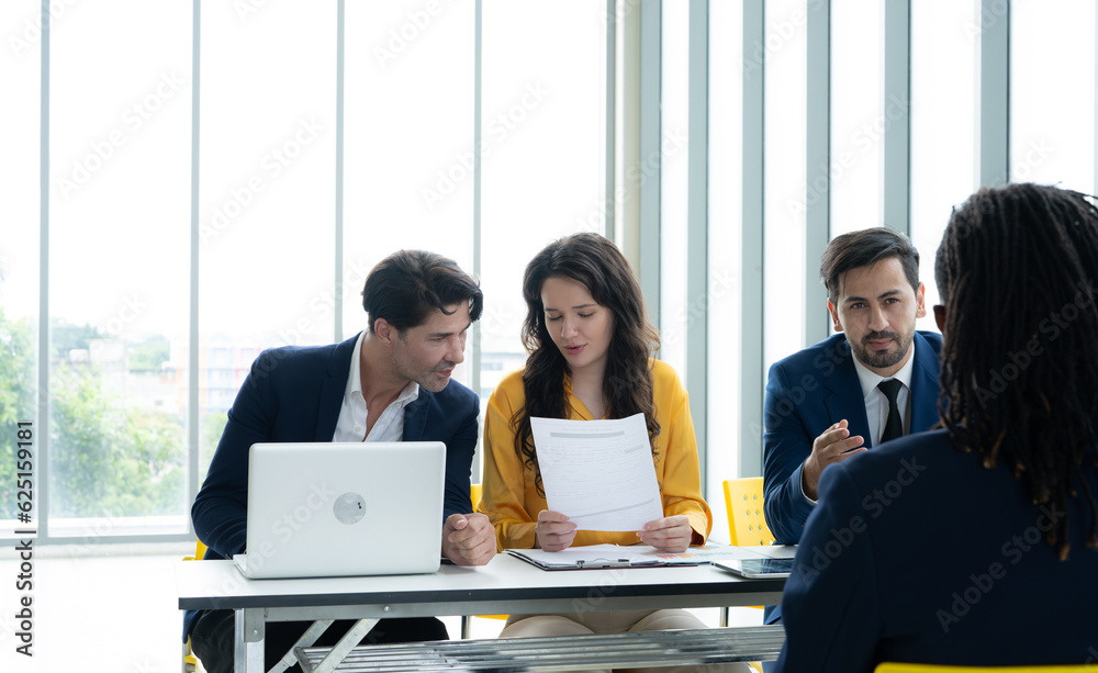 Job interview concept. Employer and diverse hr team doing job interview with a black man in business