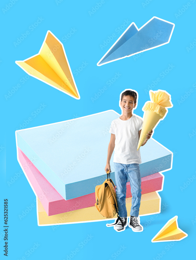 Little boy with yellow school cone and backpack on blue background