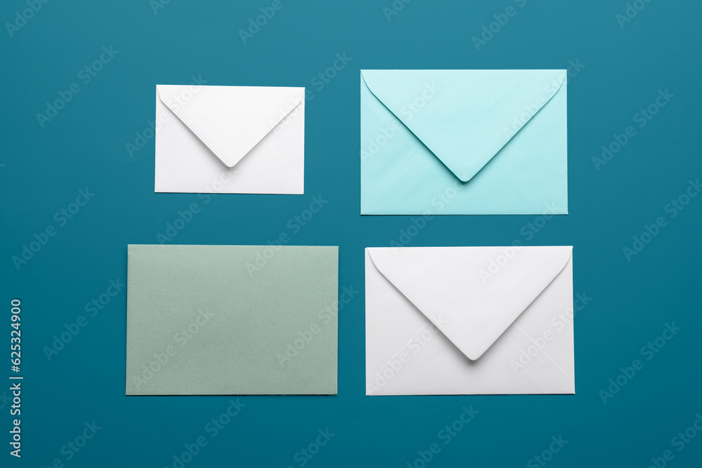 Set of different envelopes on color background