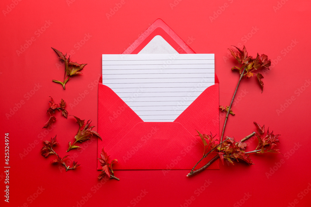 Composition with envelope, blank card and tree branches on color background