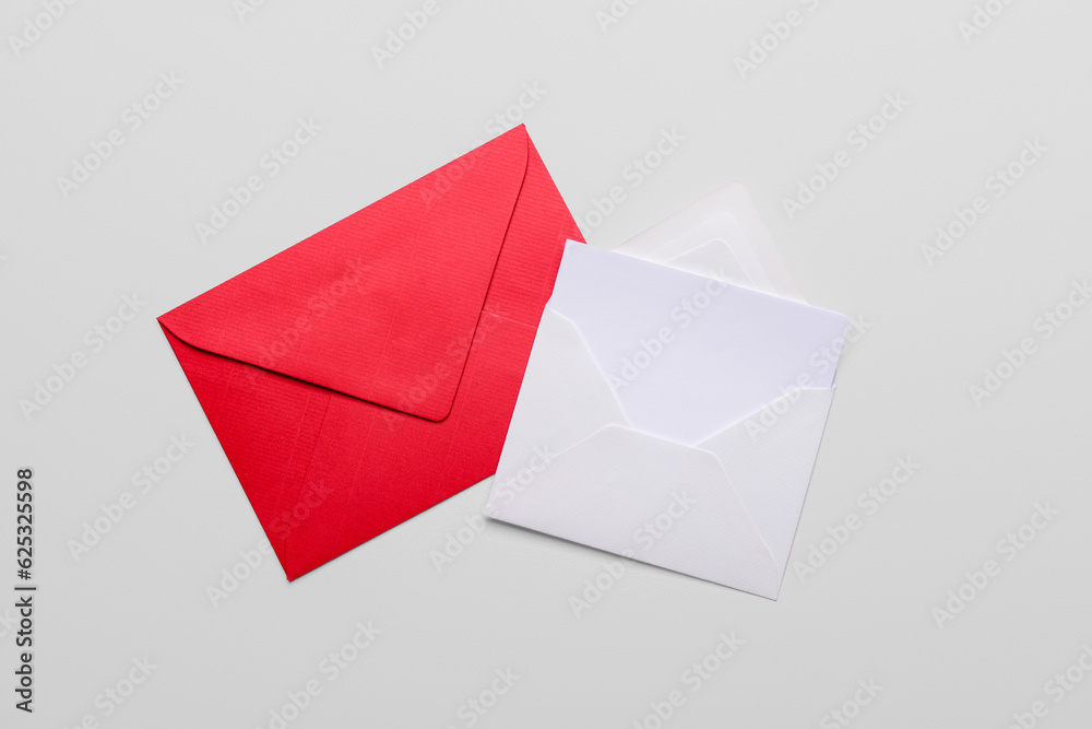 Paper envelopes with blank card on white background