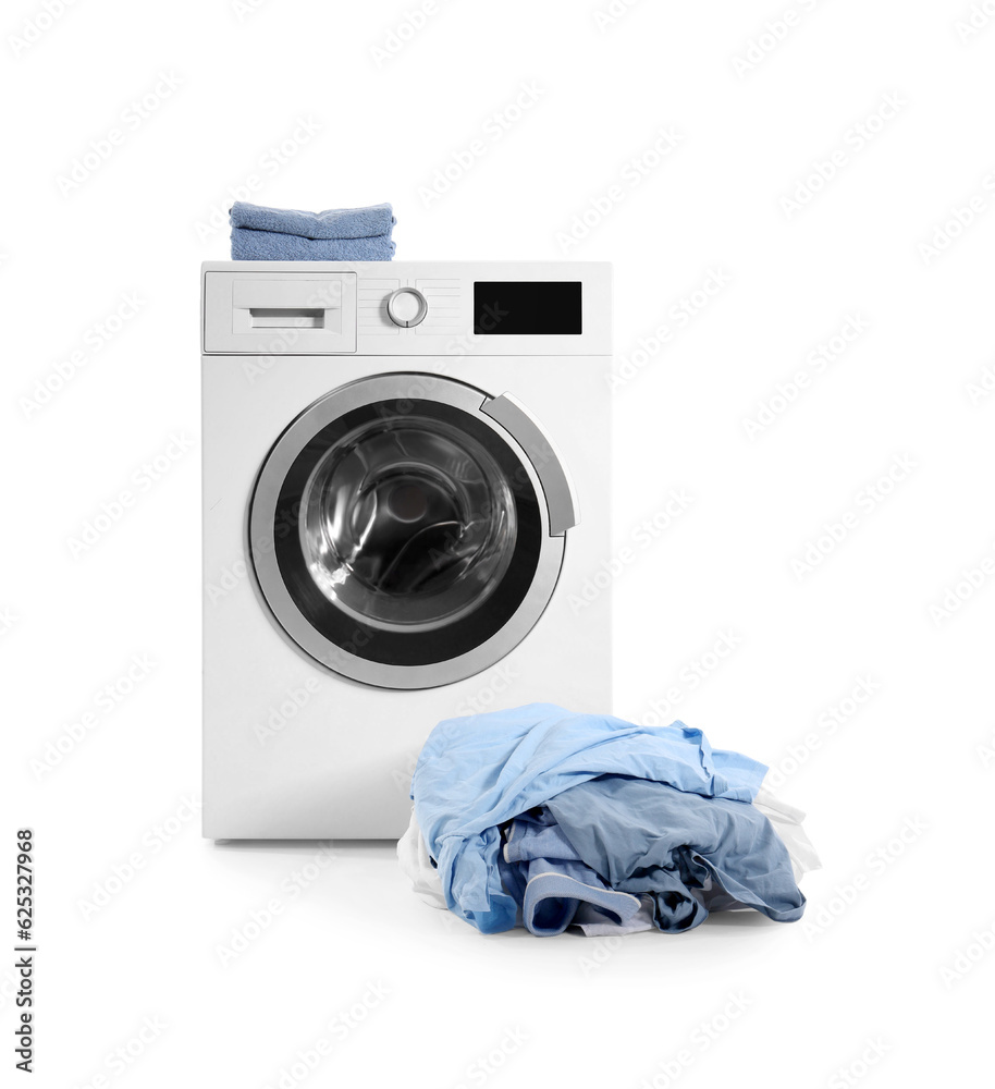 Washing machine with folded towels and pile of dirty laundry isolated on white background