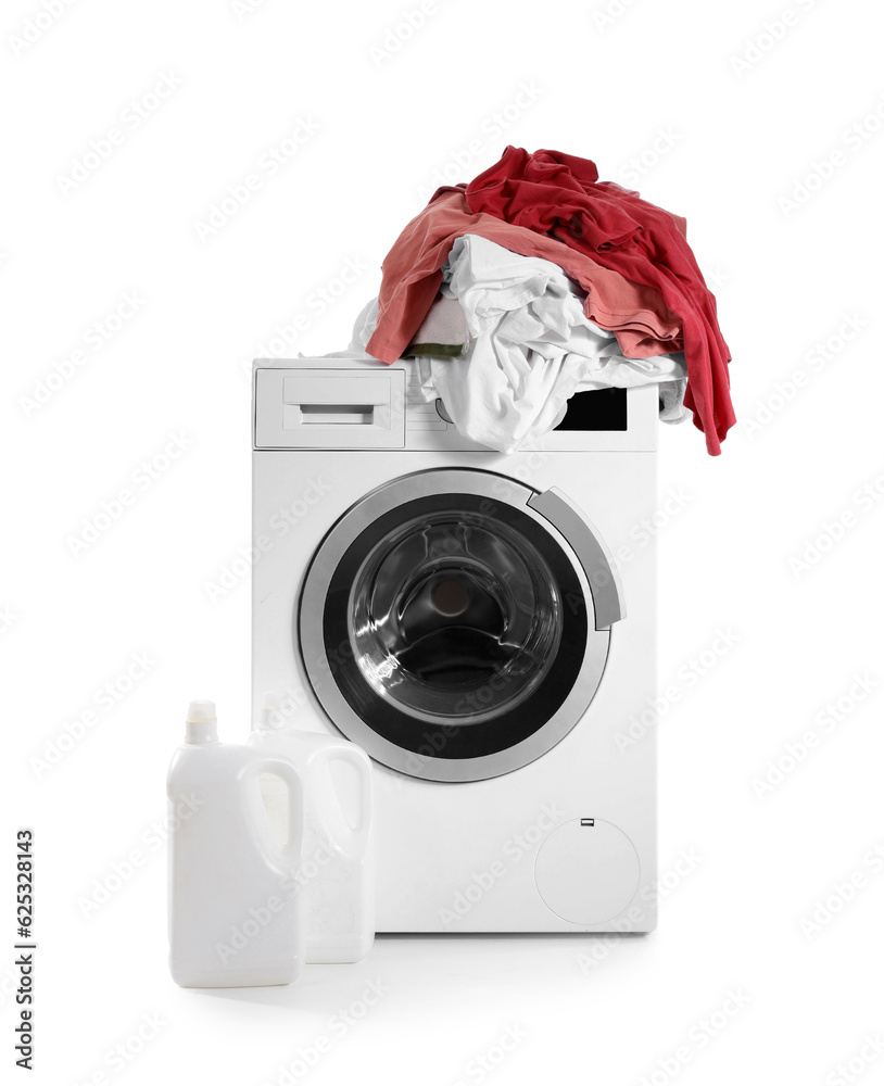 Washing machine with pile of dirty laundry and bottle of detergent isolated on white background