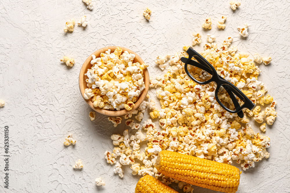 Bowl with tasty popcorn and 3D glasses on white background