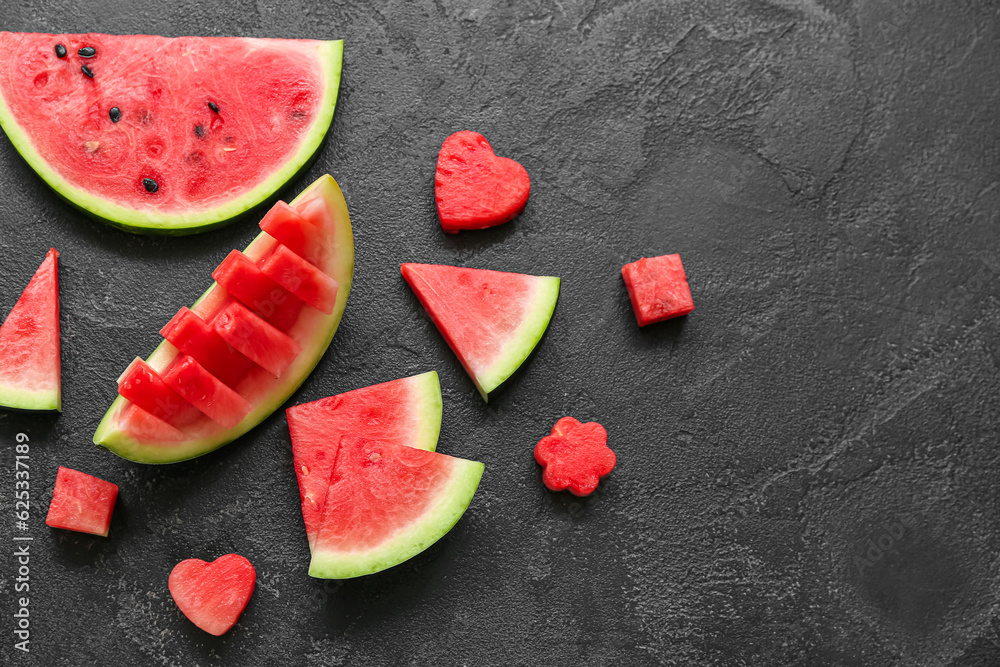 Pieces of fresh watermelon on black background