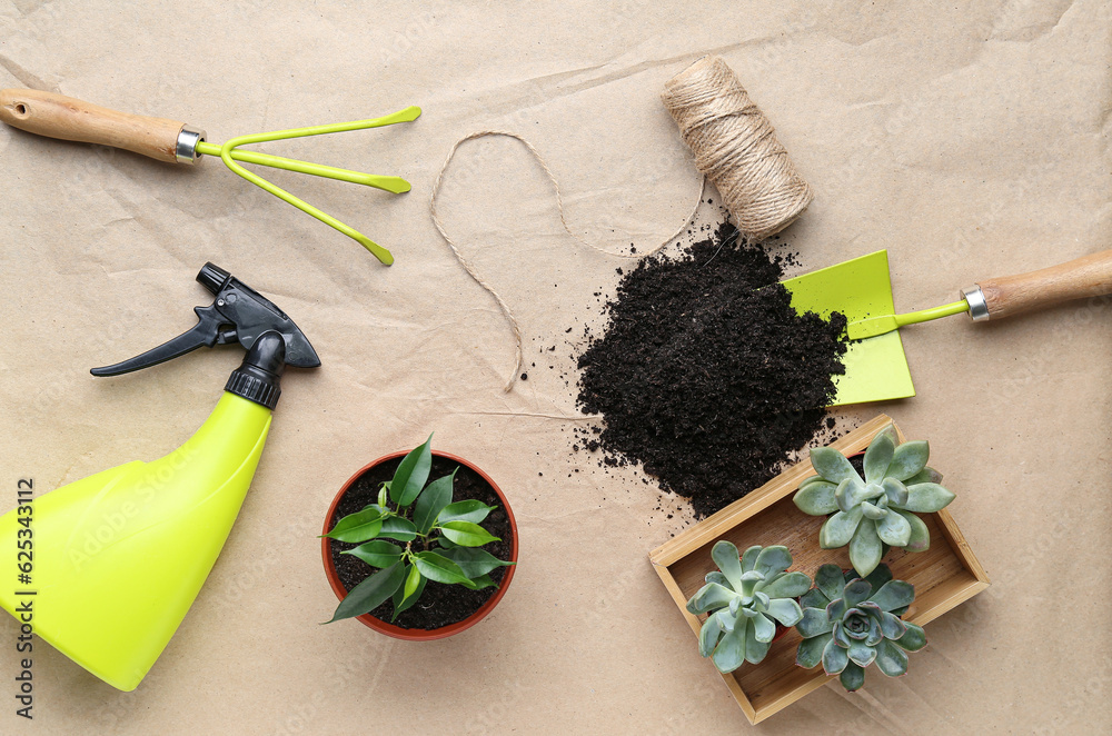 Gardening tools and plants on craft paper background