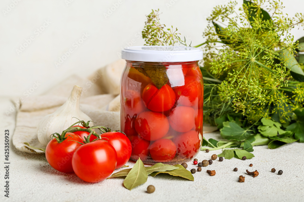 Jar with canned tomatoes and peppercorn on white background