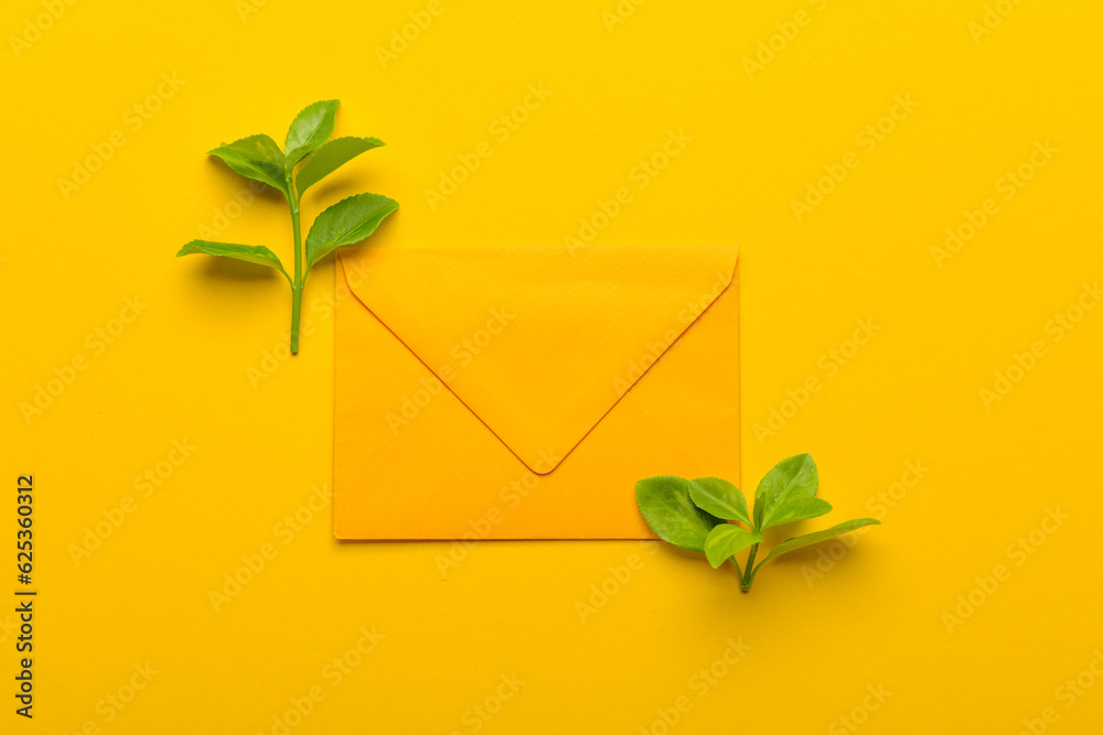 Paper envelope with plant branches on yellow branches