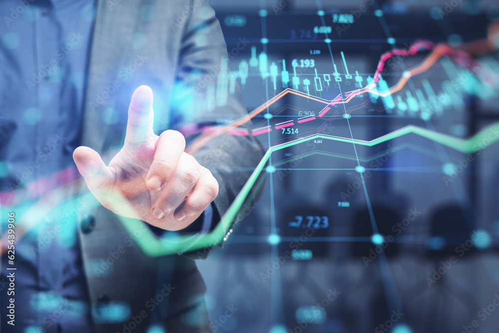 Close up of businessman hand pointing at glowing forex index chart with grid on blurry office interi