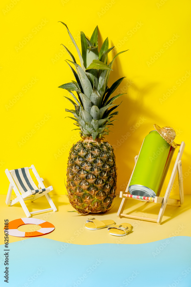 Can of soda with beach decor and pineapple on color background