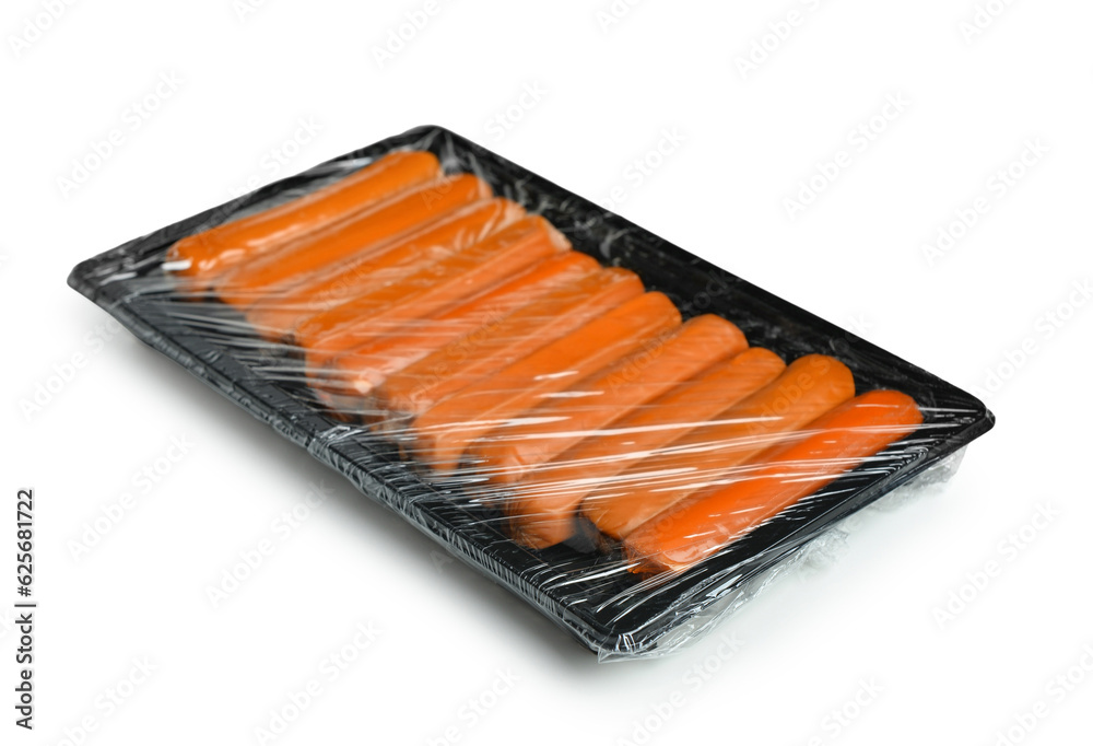 Sausages in plastic package on white background