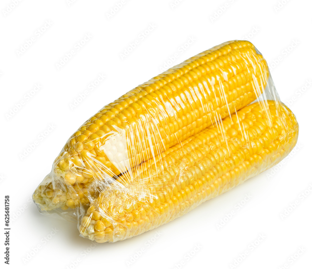 Corn in plastic food wrap on white background