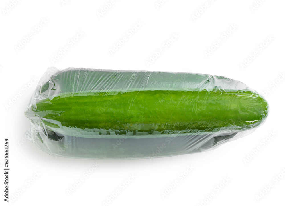 Cucumber in plastic food wrap on white background