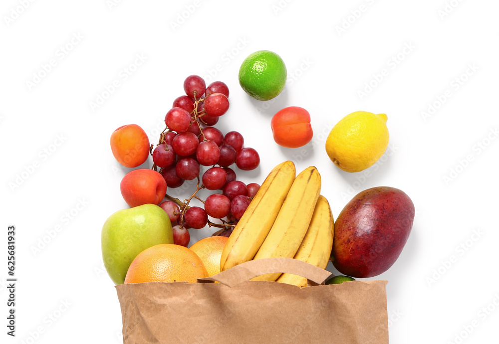 Paper bag with fresh fruits on white background. Grocery shopping concept