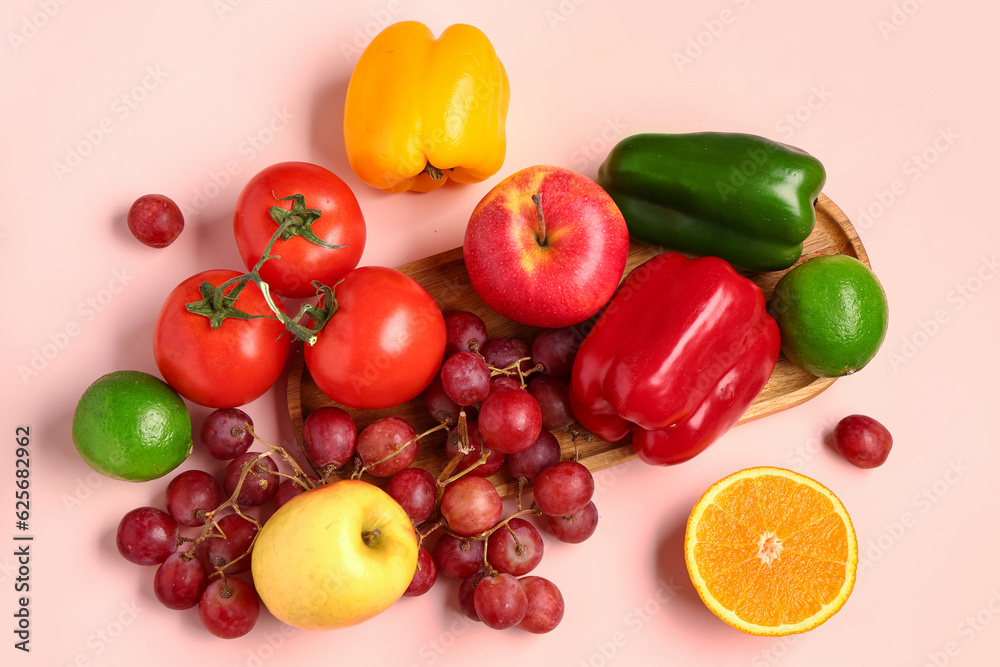 Fruits and vegetables on beige background. Healthy food concept