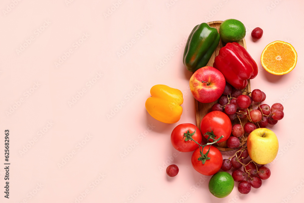 Fruits and vegetables on beige background. Healthy food concept