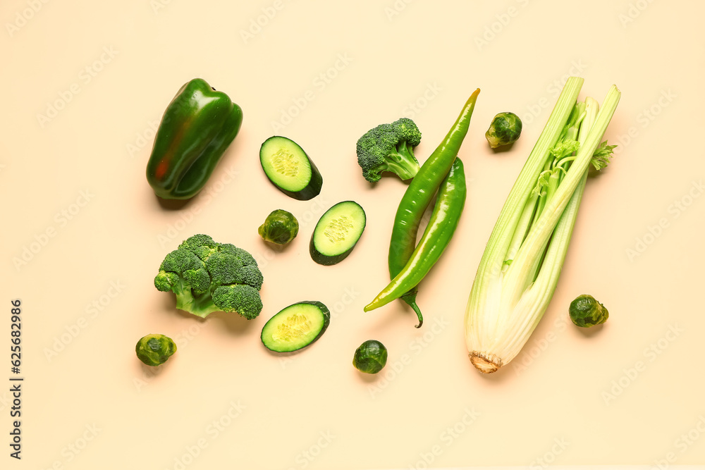 Fresh green vegetables on yellow background. Healthy food concept