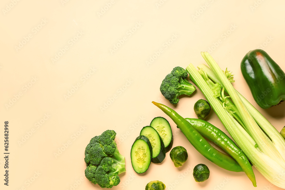 Fresh green vegetables on yellow background. Healthy food concept