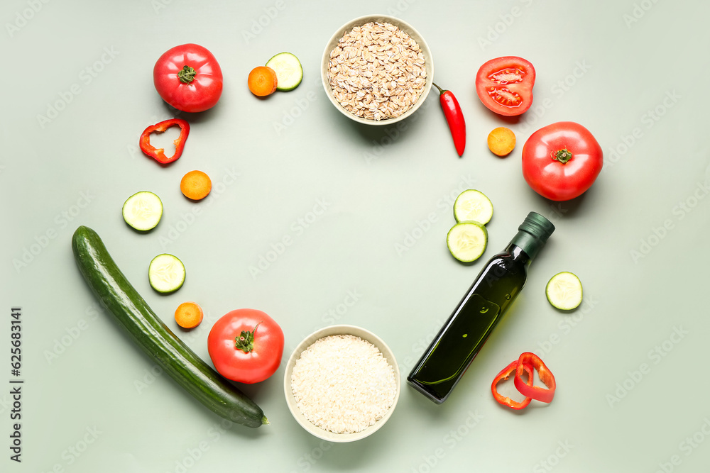 Frame made of different healthy products on green background