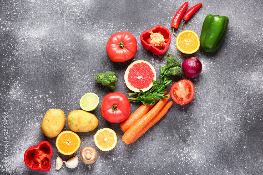 Different fresh vegetables on grey background