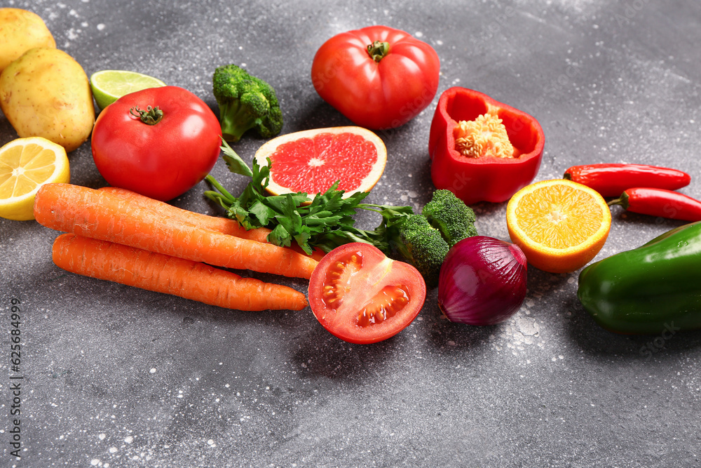 Different fresh vegetables on grey background