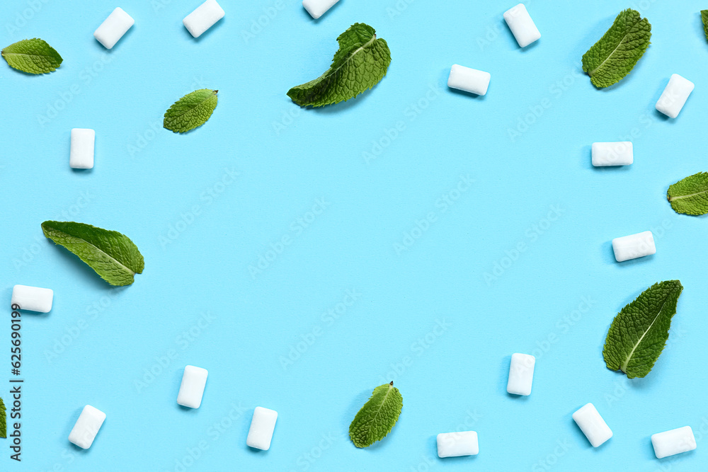 Frame made of fresh chewing gums with mint on blue background