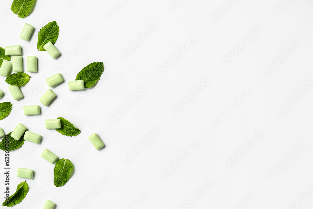 Fresh chewing gums with mint on white background