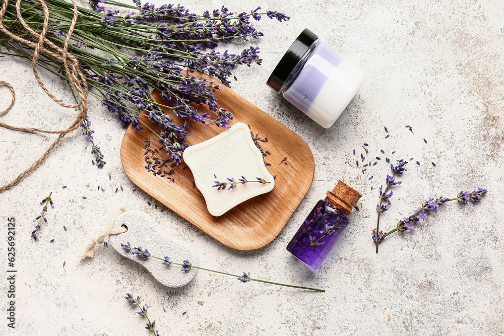 Composition with cosmetic products, pumice stone and lavender flowers on light background