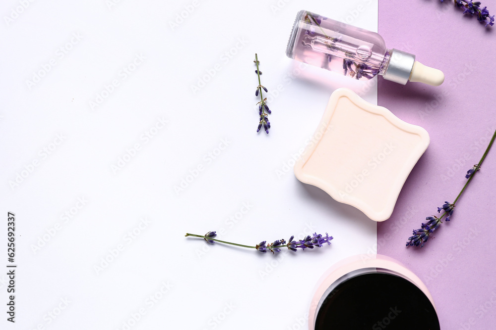 Set of cosmetic products and lavender flowers on color background