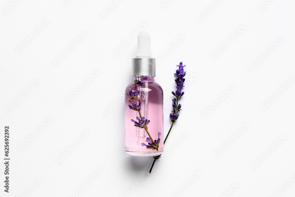 Bottle of lavender essential oil isolated on white background