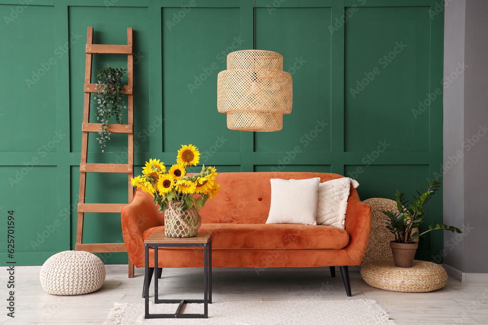 Vase with beautiful sunflowers on table in interior of living room