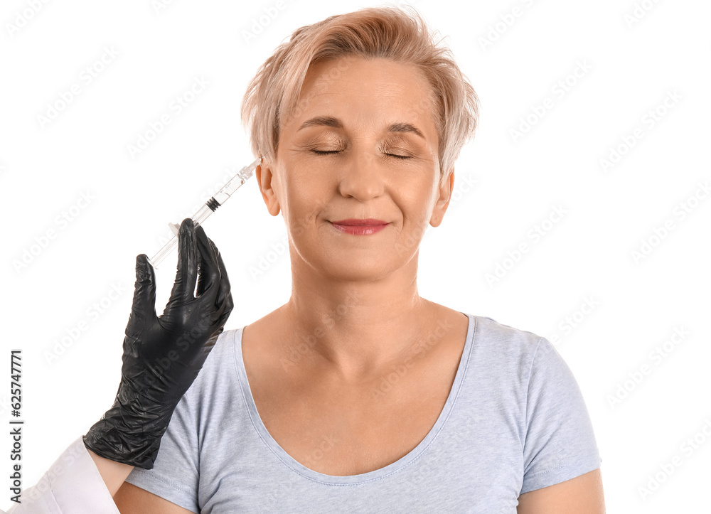 Mature woman receiving filler injection on white background, closeup