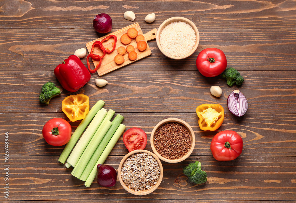 Frame made of different healthy products on wooden background