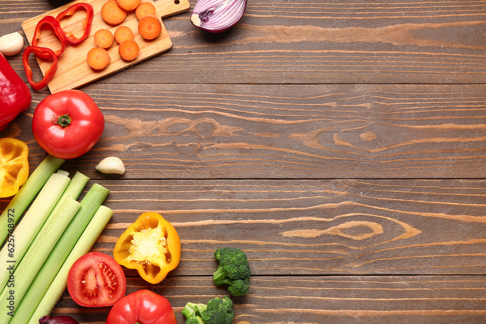 Different fresh vegetables on wooden background