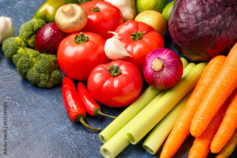 Different fresh vegetables on blue background