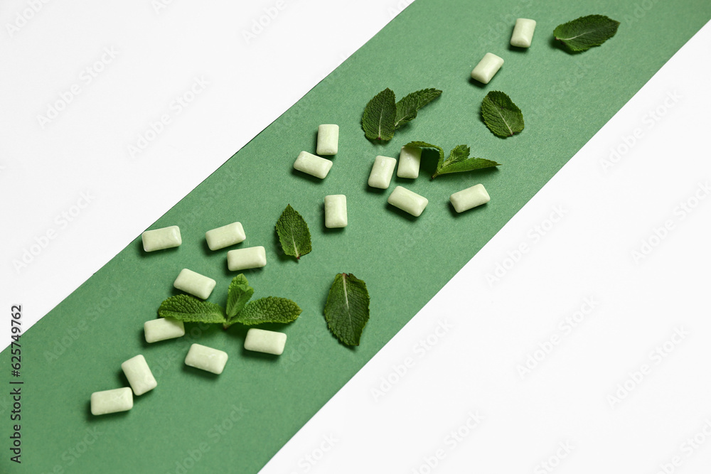 Fresh chewing gums with mint on colorful background