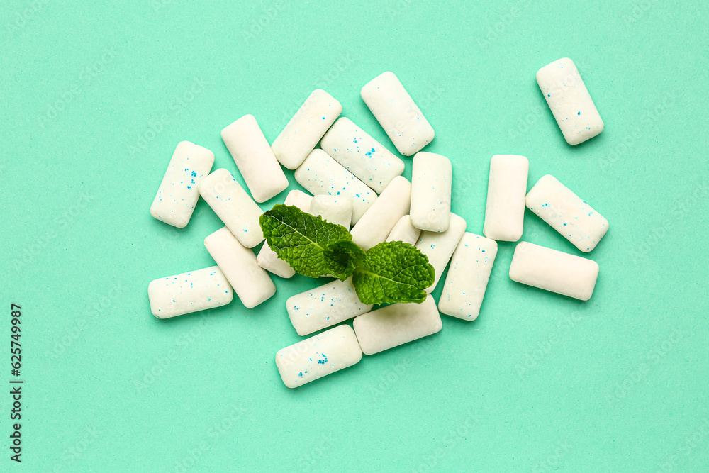 Fresh chewing gums with mint on turquoise background