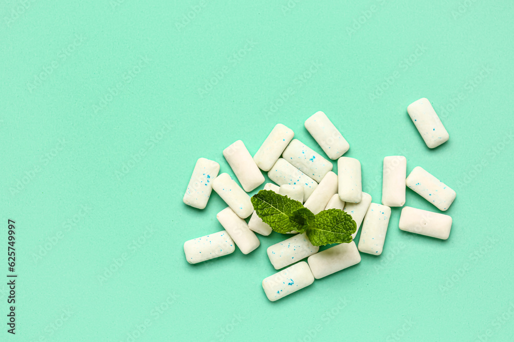 Fresh chewing gums with mint on turquoise background