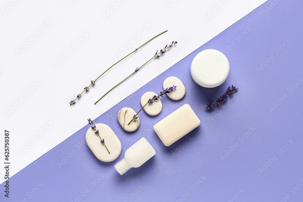 Composition with cosmetic products, spa stones and lavender flowers on color background