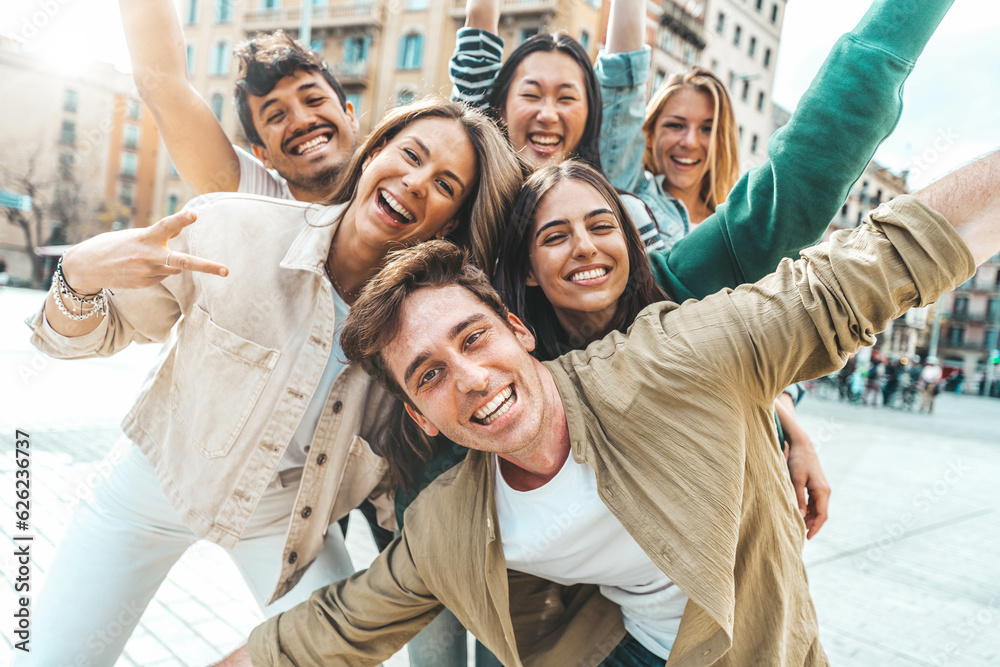 Multiracial best friends having fun outside - Group of young people smiling at camera outdoors - Fri