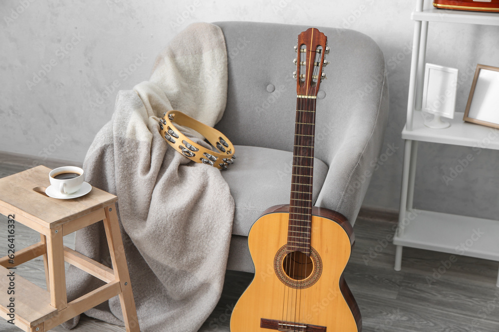 Interior of room with armchair and musical instruments