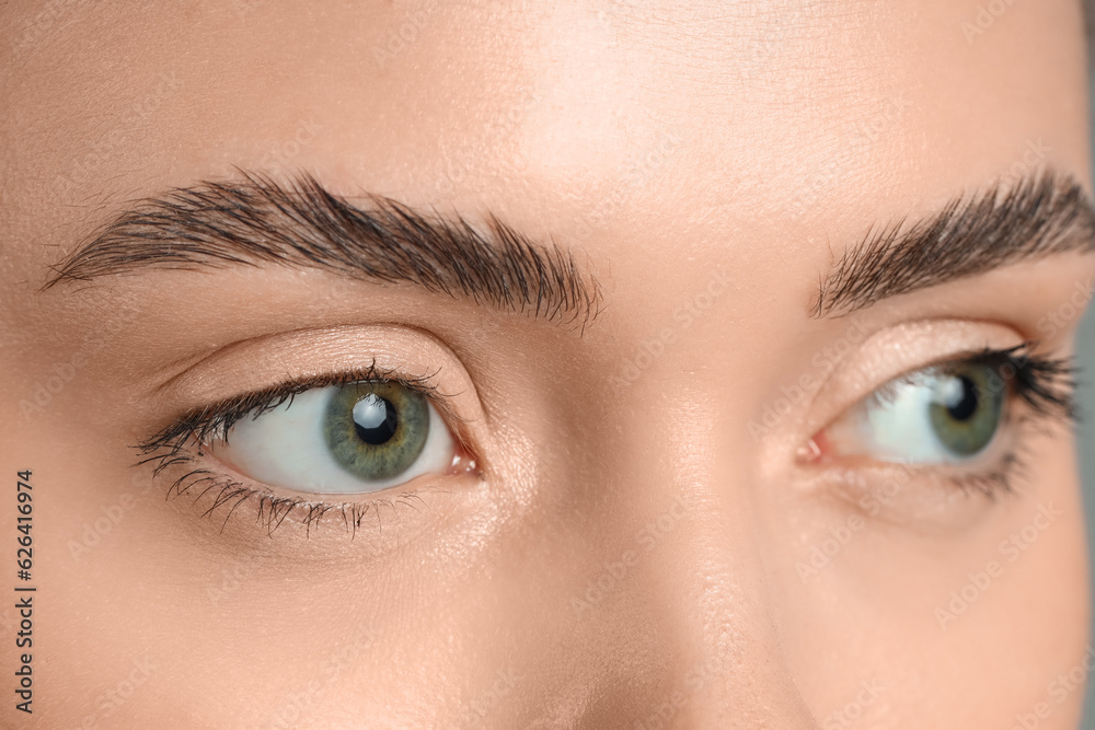 Young woman with green eyes, closeup