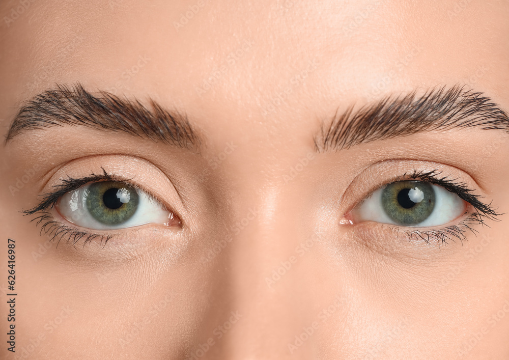 Young woman with green eyes, closeup